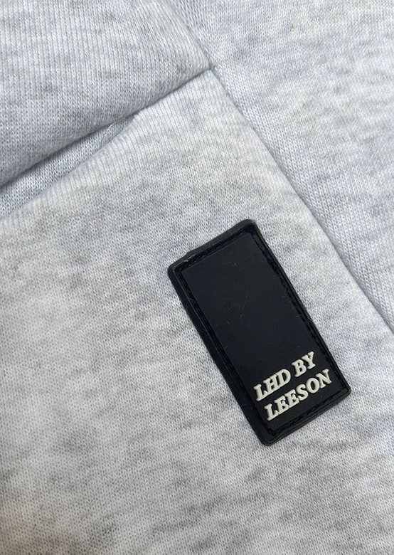 Luźna długa bluza damska ze ściągaczami jasnoszara (AMG-332A)