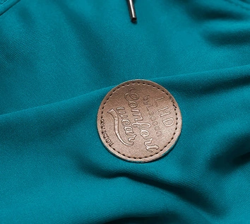 Bluza damska z ozdobnym kapturem turkusowa (AMG725-2)