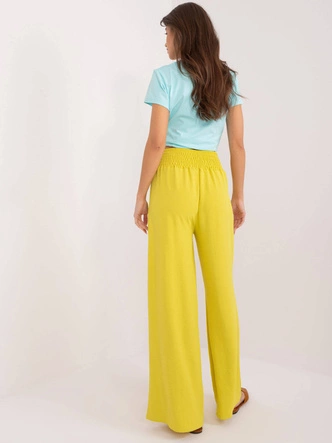 Szerokie spodnie damskie w gumę żółte (8390)